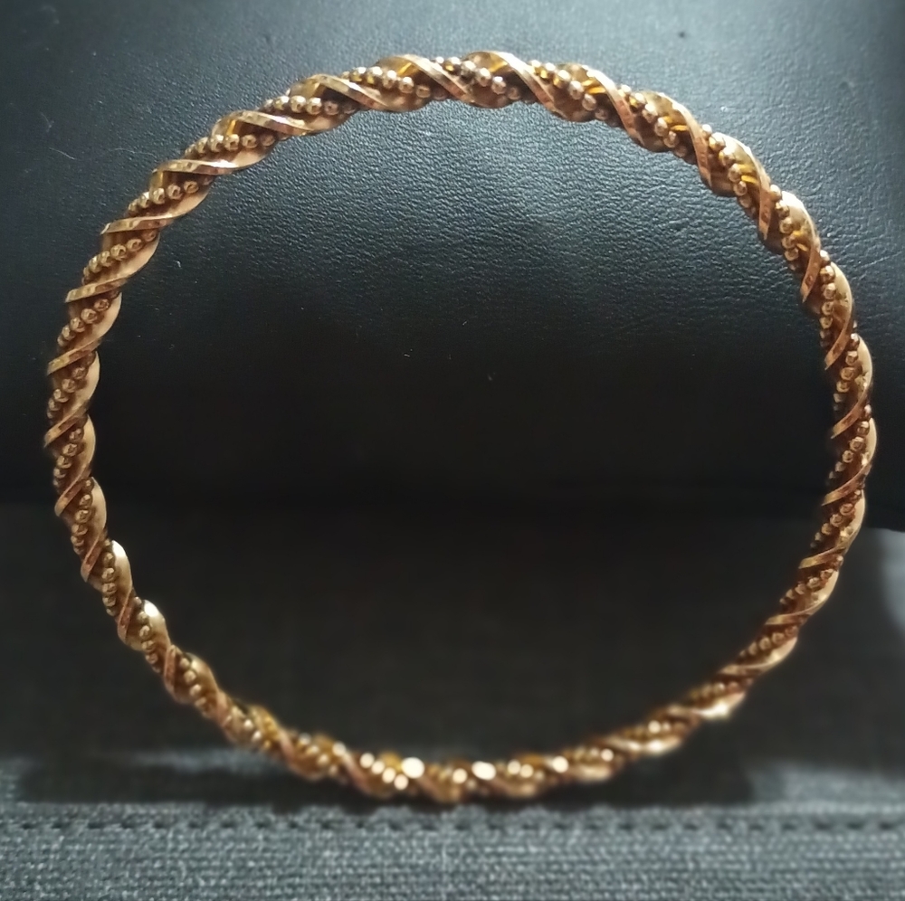 Gold tone bracelet.
